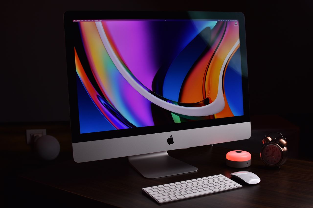 Modern Apple desktop setup with vibrant display and accessories, perfect for tech-savvy professionals.